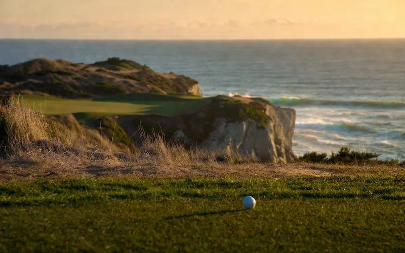Golf green on a clifftop above the ocean.